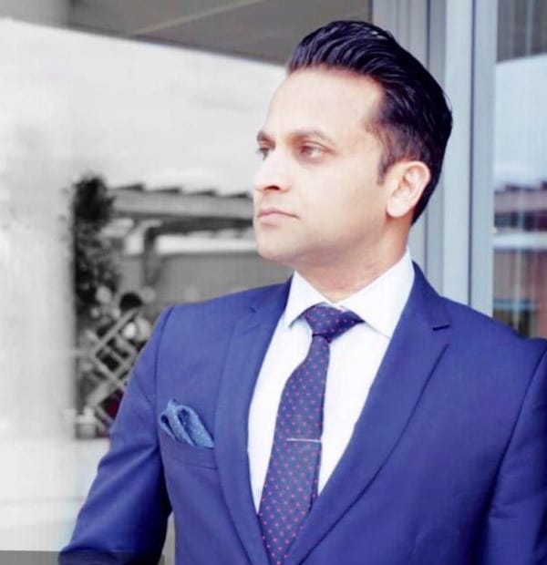Tarak Nath Gorai Bio Headshot in a cool blue suit